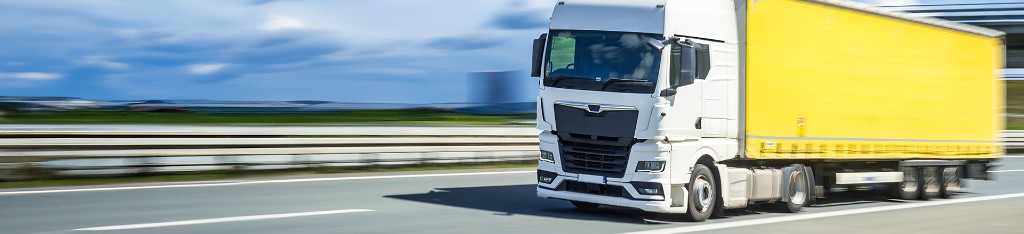 Commercial truck on highway, wholesale automotive and retread tires